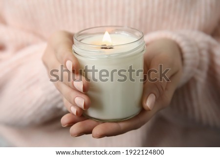 Similar – Image, Stock Photo Woman holding a candle at night, during the Easter celebrations