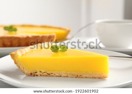 Similar – Image, Stock Photo Sliced lemon pie on blue background. Fruit tart slices