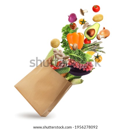Paper bag with vegetables and fruits on white background. Vegetarian food  Stockfoto © 