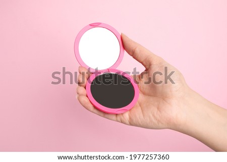 Similar – Image, Stock Photo Hand holding a mirror with daisies in reflection