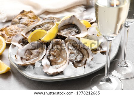 Similar – Image, Stock Photo Fresh oysters with lemons in restaurant