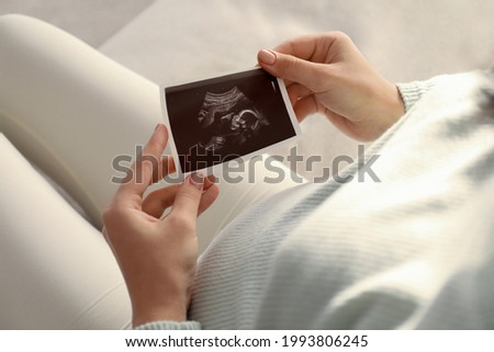 Similar – Image, Stock Photo Woman holding the ultrasound of her baby