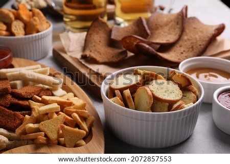 Many different crispy rusks served on light table Сток-фото © 