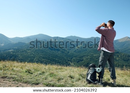 Similar – Image, Stock Photo Male hiker with backpack in highland valley