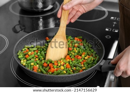 Image, Stock Photo Cooking of green peas with eggs