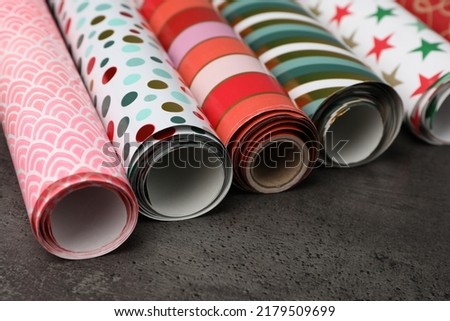 Similar – Image, Stock Photo many colorful paper rolls are stacked on a brown wooden table