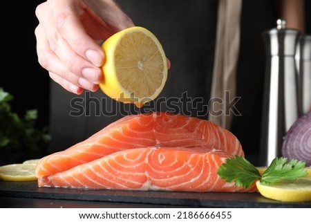 Image, Stock Photo Raw fish with lemon and herbs