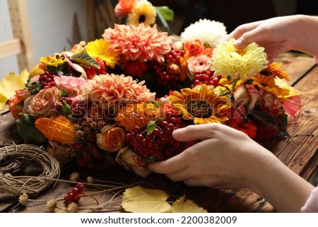 Similar – Image, Stock Photo Beautiful autumn wreath or circle frame made with pretty fall leaves, chestnuts, nuts, acorns and flowers on white background. Top view. Flat lay. Creative layout