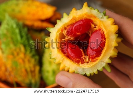 Similar – Image, Stock Photo Woman showing half orange over bowl