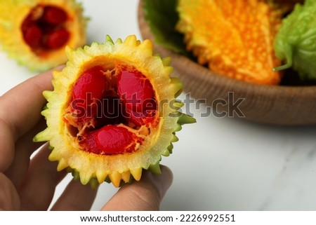 Similar – Image, Stock Photo Woman showing half orange over bowl