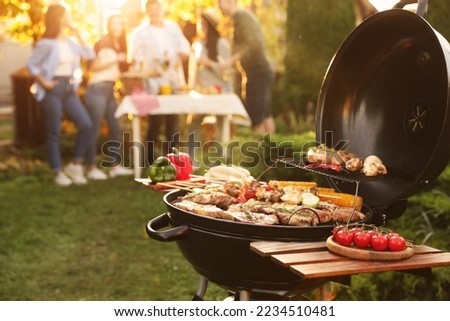 Similar – Image, Stock Photo Barbecue season: BBQ grill with steaks and sausages in the park