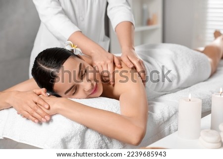 Similar – Image, Stock Photo Adult woman enjoying massage in spa salon