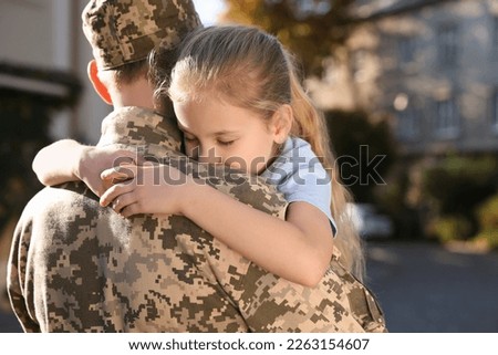 Similar – Image, Stock Photo Girl hugging military man after homecoming