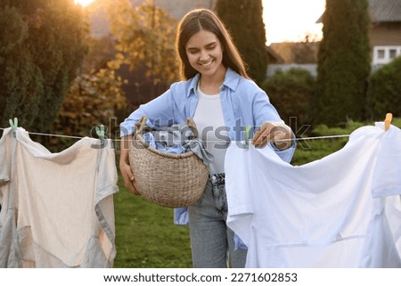 Similar – Image, Stock Photo hanging out the clothes outdoors