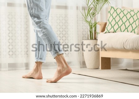 Similar – Image, Stock Photo Barefoot woman standing on beach at sunset