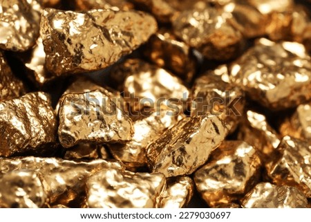 Pile of gold nuggets as background, closeup Imagine de stoc © 