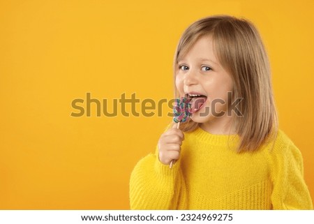 Similar – Image, Stock Photo Girl with lollipops in the form of a kiss