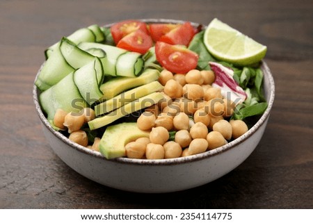 Similar – Image, Stock Photo Tasty salad on wooden stand served on decorated table outside