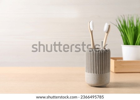 Similar – Image, Stock Photo two bamboo toothbrushes in a jar with space for your text