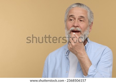 Similar – Image, Stock Photo Senior man taking prescription medicine at home