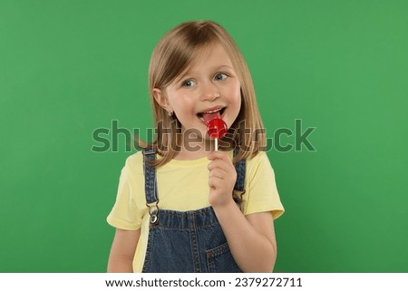 Similar – Image, Stock Photo Girl with lollipops in the form of a kiss