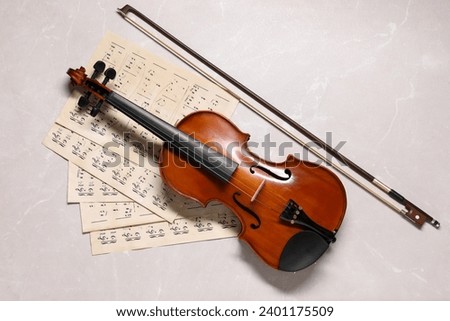 Similar – Image, Stock Photo Violin and bow in the hand of the musician in an empty room. Ban on performing in the Corona Crisis