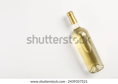Image, Stock Photo Single white wine glass and potato chips on white table at home. Single apartment living. Home interior with yellow couch. Relaxing evening alone at home. One-person households are becoming increasingly common across the world. Millennial lifestyle.