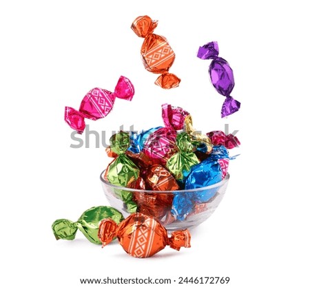 Similar – Image, Stock Photo Many colorful candies fall down in front of a black background