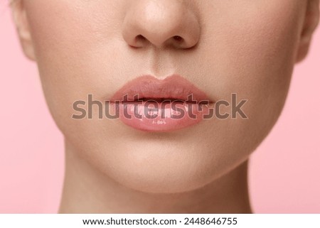 Similar – Image, Stock Photo Woman lipstick on pink background with copy space