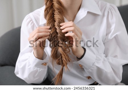Similar – Image, Stock Photo Woman with braids in studio looking at camera
