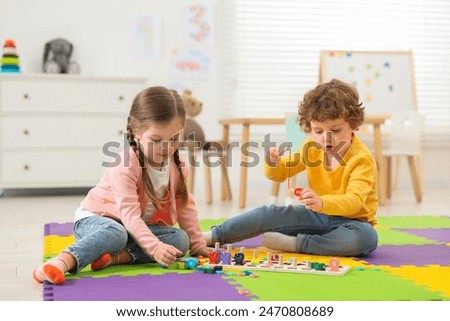 Similar – Image, Stock Photo Children playing with fishing rod toy in a pool in a home garden