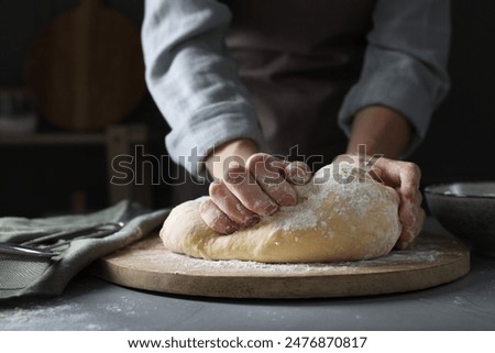 Similar – Image, Stock Photo A dough is kneaded on a kitchen table and dusted with flour