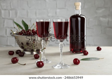 Similar – Image, Stock Photo a cherry liqueur and a beer on the pub table with tablecloth