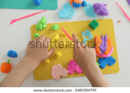Similar – Image, Stock Photo Little girl laying playing on grass enjoying summer day during vacation trip