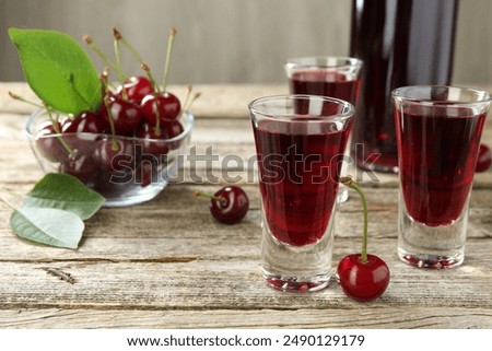 Image, Stock Photo a cherry liqueur and a beer on the pub table with tablecloth