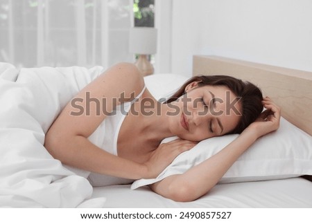 Similar – Image, Stock Photo Young woman lying in bed suffering, tired woman covering face with hands, can’t sleep feels exhaustand on white sheets in bedroom