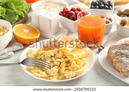 Similar – Image, Stock Photo Scrambled eggs in a blue plate, top view on a yellow table.