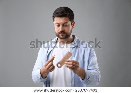 Similar – Image, Stock Photo sad man lost in thought