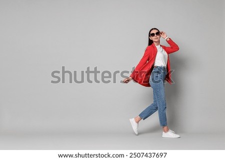 Similar – Image, Stock Photo Trendy businesswoman and sunglasses leaning behind bus