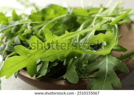 Similar – Foto Bild Frische Rucola-Blätter in einem Strauß auf grünem Tisch. Rucola-Bündel