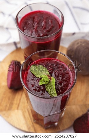 Similar – Image, Stock Photo Beetroot and fresh smoothie on wooden table