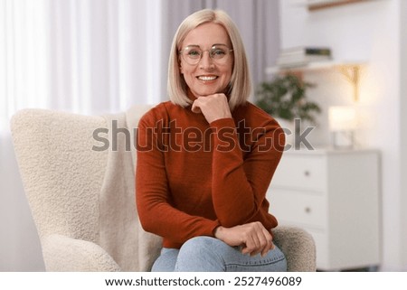 Similar – Image, Stock Photo Middle aged woman on a edge of an infinity pool with a ocean background