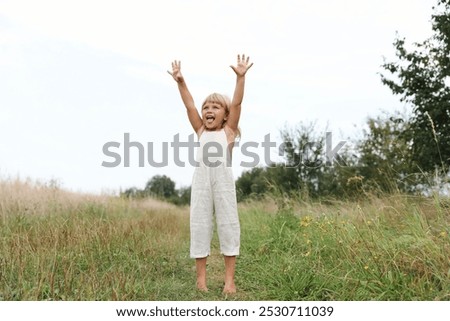 Similar – Image, Stock Photo Little girls walking barefoot on the sand and caring a picnic basket together. Summer leisure, love and friendship.