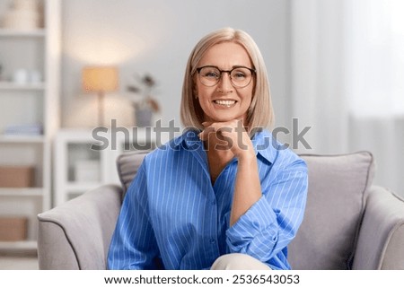 Similar – Image, Stock Photo Middle aged woman on a edge of an infinity pool with a ocean background