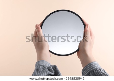 Image, Stock Photo Hand holding a mirror with daisies in reflection