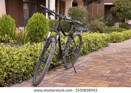 Similar – Foto Bild Fahrrad vor modernem Gebäude geparkt