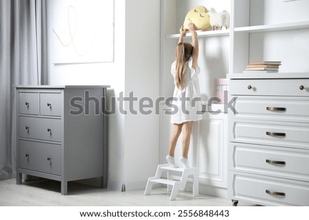 Similar – Image, Stock Photo back view of kid under a pier