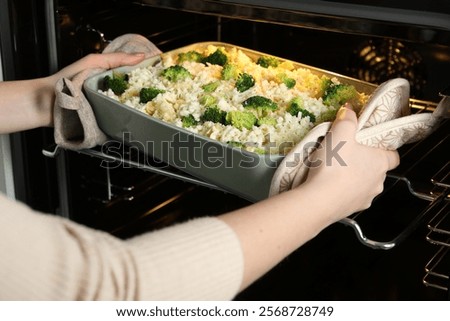 Similar – Image, Stock Photo Casserole is put in the oven