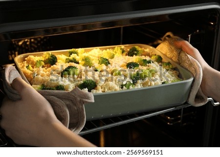 Similar – Image, Stock Photo Casserole is put in the oven