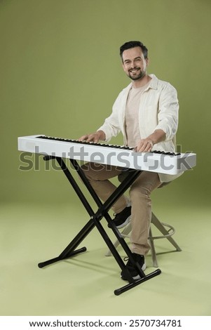 Similar – Foto Bild Mann spielt Synthesizer im Aufnahmestudio